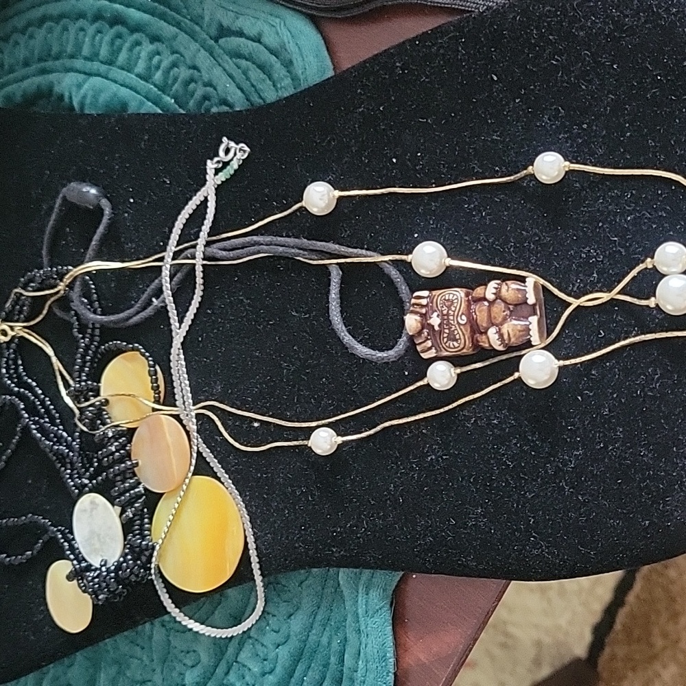 Tiki necklace and 3 other necklace